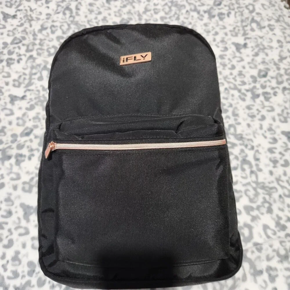 Ifly Travel Backpack Black 18x11x5 Durable Fabric And Metallic Hardware.